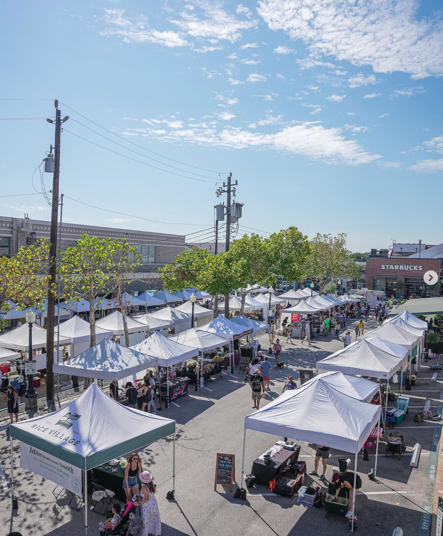 White tents aerial picture from Farmers Market.