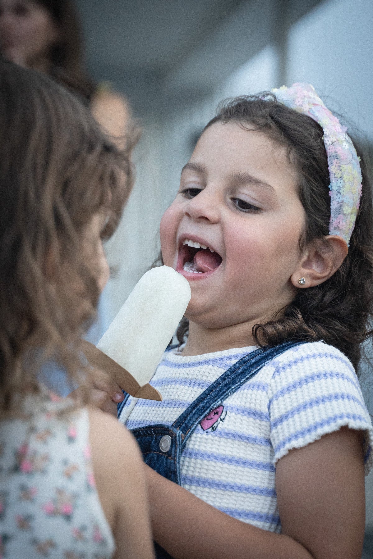Kid enjoying refreshing Lemonade popsicle