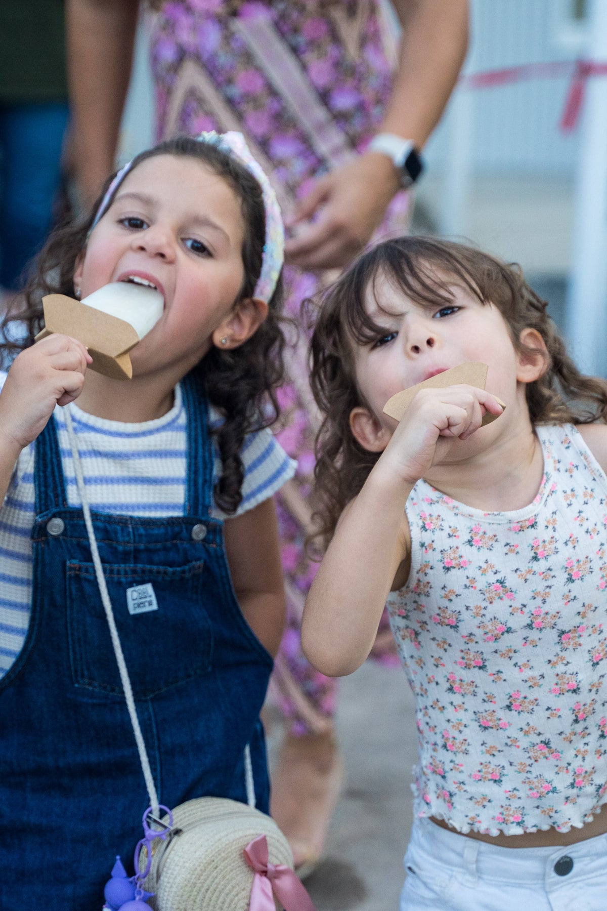 Kids enjoying Wonder Pops popsicles at a Houston farmers market